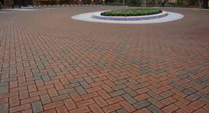 A brick walkway with a circular pattern in the center.