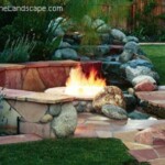A fire pit in the middle of a garden.