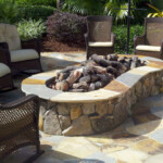 A fire pit in the middle of an outdoor patio.