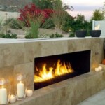 A fireplace with candles on the outside of it
