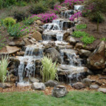 A waterfall in the middle of a garden.