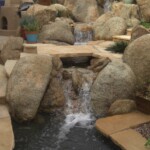 A waterfall in the middle of a garden.