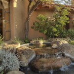 A fountain in the middle of a garden.