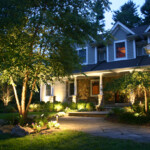 A house with lights on the front of it