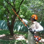A man holding a pole with a string attached to it.
